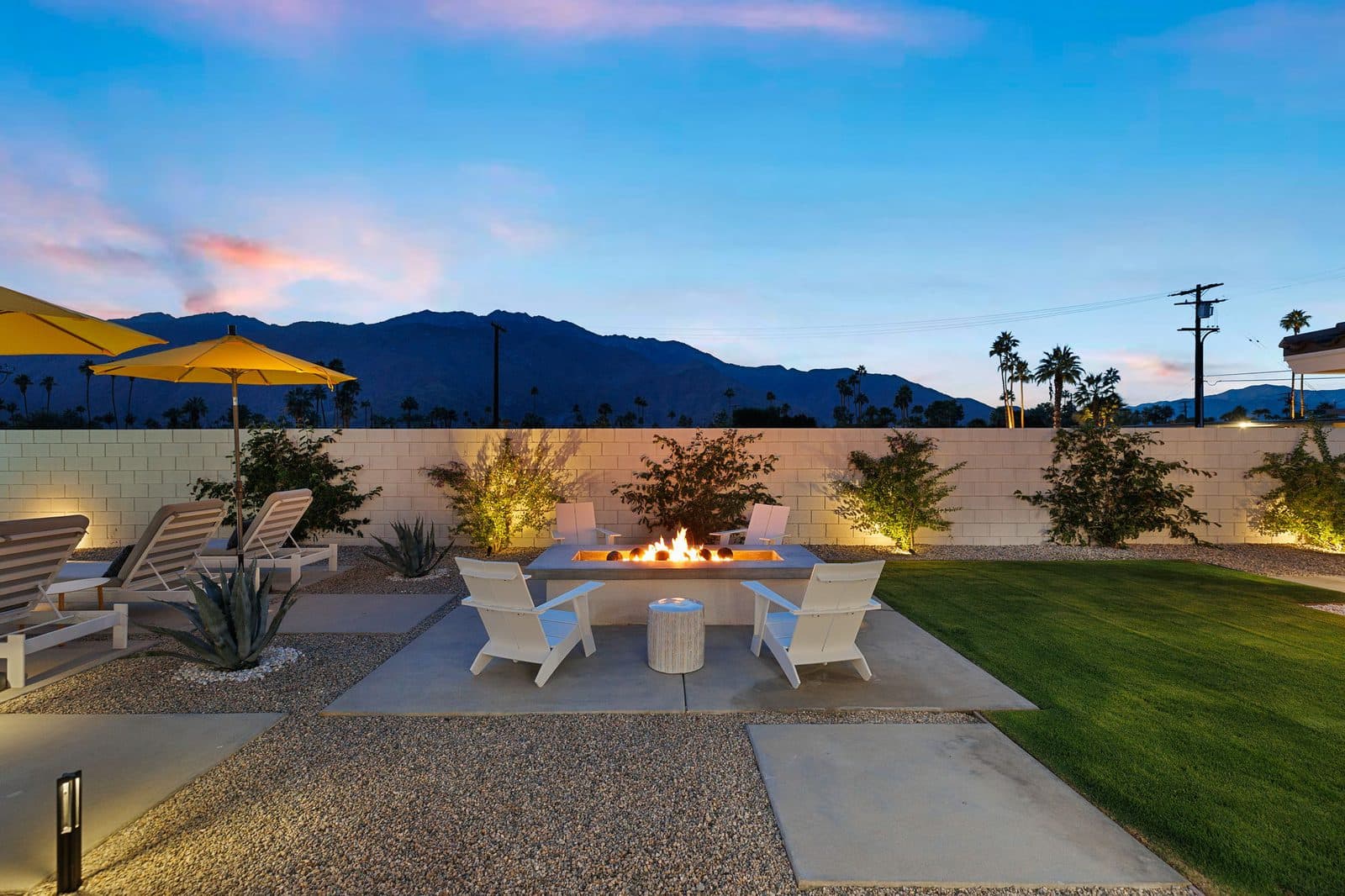 The gas fire pit, with Adirondack chairs facing the mountains. Made for long desert evenings.
