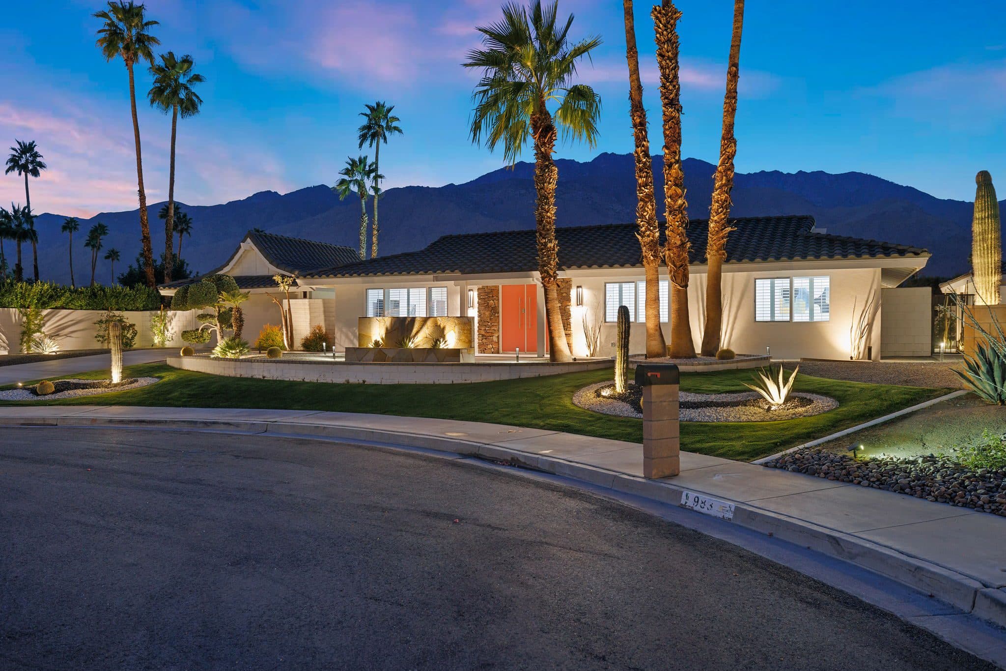 Twilight on a quiet cul-de-sac, with the San Jacinto Mountains rising behind the house.