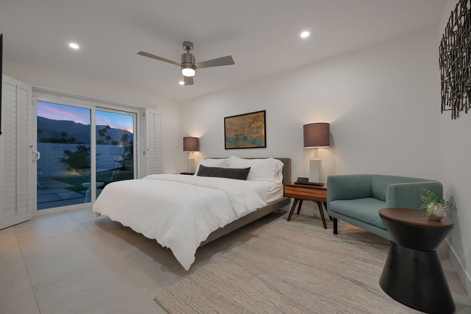 Primary bedroom with king bed and sliding doors to the backyard